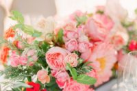 18 a wooden box with sherbet pink blooms and much textural greenery for a wedding centerpiece