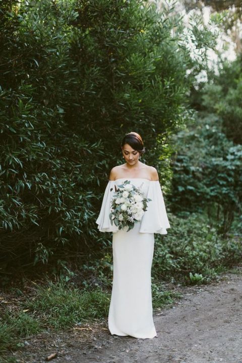 an off the shoulder plain sheath wedding dress with long bell sleeves