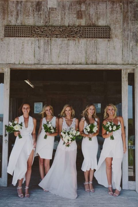 gorgeous mismatching modern white bridesmaid dresses and blush strappy shoes