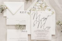 23 a gorgeous white wedding invitation suite with black letters and botanical lining
