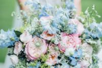 24 a pastel wedding bouquet with blush, pink and pastel blue blooms and greenery