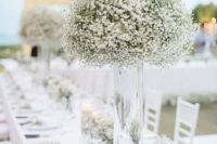25 a chic white wedding tablescape with white blooms, some greenery and touches of gold plus black cutlery