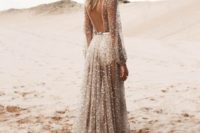 27 a nude wedding dress with a cutout back, a train and sheer everything