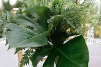 27 wedding chair decor with lush tropical leaves and greenery plus some light blooms