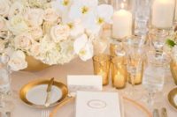 29 a refined and chic wedding tablescape with roses and orchids, candles and touches of gold