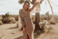 30 a nude dress with silver glitter stripes, bell sleeves, a front slit comprises several trendy features