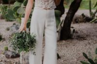 40 a bridal pantsuit with a lace strap crop top and wide leg pants is a trendy boho idea