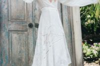 44 a boho wrap wedding dress by Spell with a high low skirt, a deep V-neckline and bell sleeves plus lace inserts