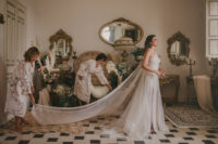 02 The bride was wearing a white sequin one shoulder wedding dress with a slit, an overskirt and a long train