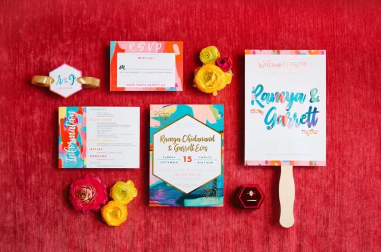 The colorful wedding stationery was created by the bride herself as she's an artist