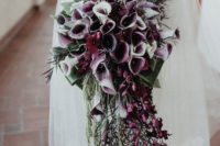02 The wedding bouquet was done of purple callas, greenery and it was lush and cascading