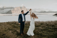 swiss alps is a great background for a bride in a mermaid dress