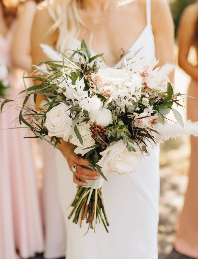 The wedding bouquets were super lush, white and veyr textural, with berries and greenery