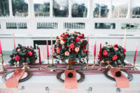04 The wedding tablescape was done with a pink velvet runner, pink and red roses and candles plus gold touches