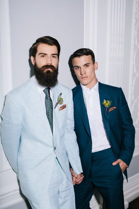 chic light blue and teal wedding suits, a printed green tie and matching boutonnieres for a modern wedding