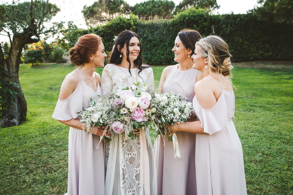 The bridesmaids were rocking mismatched blush maxi gowns