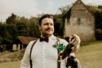 05 The groom was wearing a simple look with brown pants, a white shirt, suspenders and a whimsy bow tie.jpg