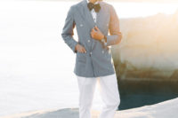 06 The groom was wearing an island look with white pants, vintage shoes, a grey oversized blazer and a polka dot bow