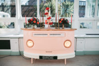 06 The wedding cake bar was a pink one, styled as a retro van, red and pink candles and a gorgeous cake