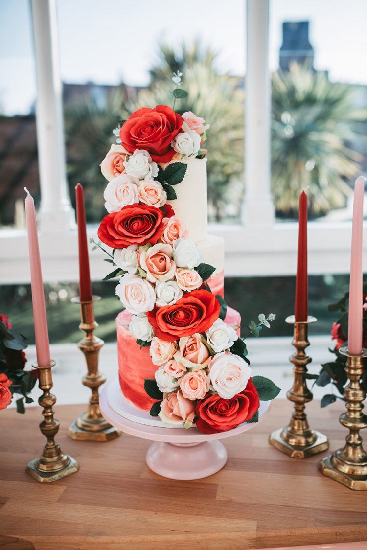 The wedding cake was an ombre red one, with lush red, pink and white blooms and greenery