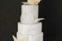 09 The wedding cake was a marbleized white one topped with dried fronds