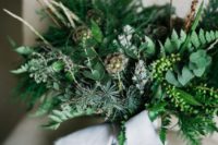 09 a lush and textural greenery wedding bouquet and twigs plus blue ribbons is a chic idea