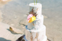10 The marbled wedding cake was decorated with bold blooms and gilded leaves