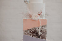 10 The wedding cake is a masterpiece in white, pink, lilac and silver leaf plus disco balls and blooms