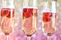 10 signature drinks with raspberies and wooden drink stirrers with gold glitter tops are amazing