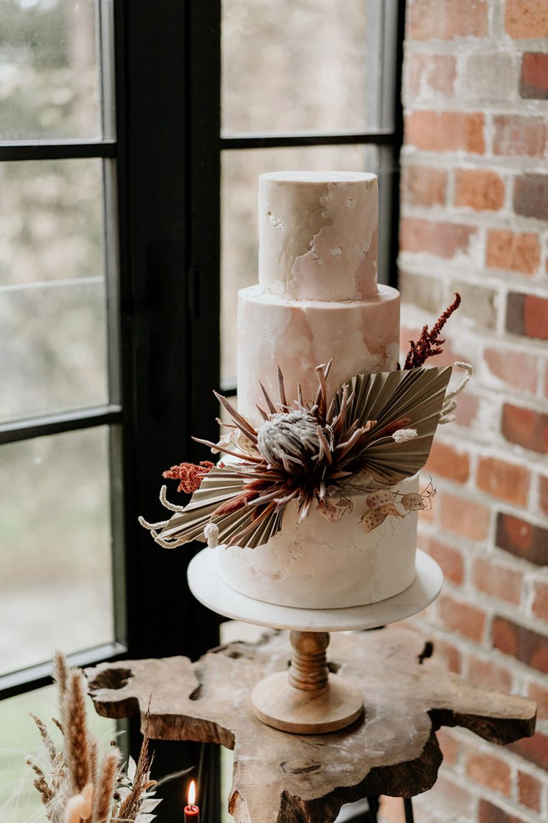 The wedding cake was a pink marble one decorated with large tropical blooms
