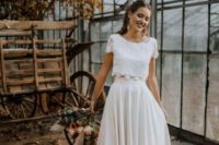 14 a chic bridal separate with a lace crop top with short sleeves and a pleated high low maxi skirt