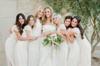 18 white maxi bridesmaid dresses with cap sleeves and a high neckline plus side slits
