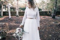 20 a modern and bold bridal separate with a white sequin crop top and long sleeves and a pleated white tulle maxi skirt