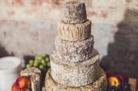 26 a cheese wheel wedding cake is a very cool idea for any wedding, where the couple doesn’t like sweets much