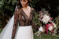 26 an edgy modern bridal outfit with a black lace top with long sleeves and a plain skirt plus a veil for an edgy look