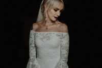 03 The bride was an off the shoulder lace sheath wedding dress with bell sleeves and a dark lipstick
