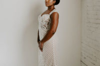 03 The bride was wearing a boho lace BHDLN weddin dress with a train and a deep neckline