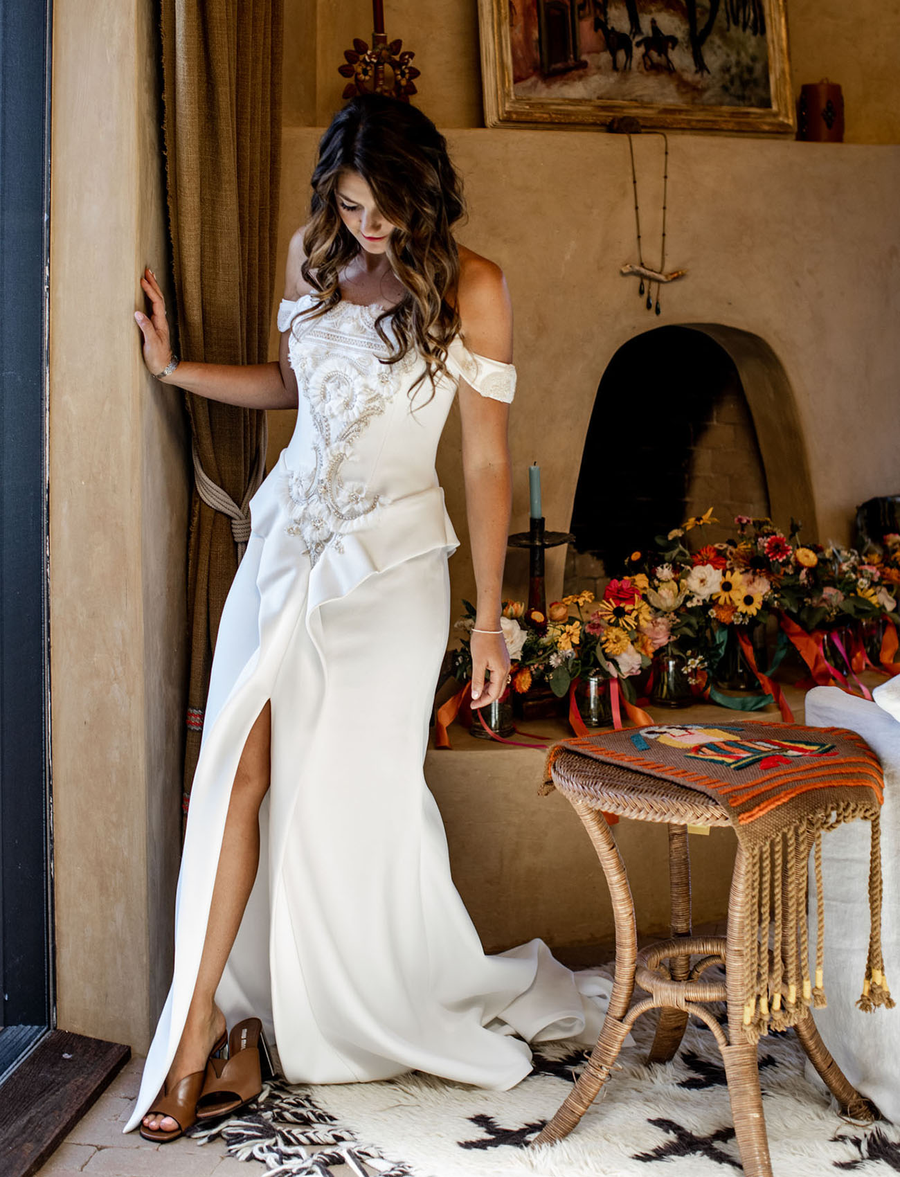 The bride was wearing a fantastic off the shoulder wedding dress with appliques and embroidery and mules