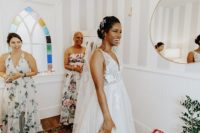 03 The bride was wearing a gorgeous A-line lace applique wedding dress with a deep neckline and a veil