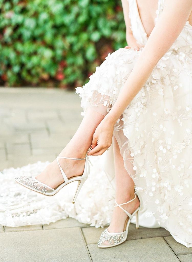 The lace up wedding shoes were embellished and perfectly added a bling to the bridal look