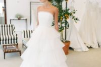 03 a classic wedding ballgown with a strapless embellished bodice and a tiered tulle skirt with a train