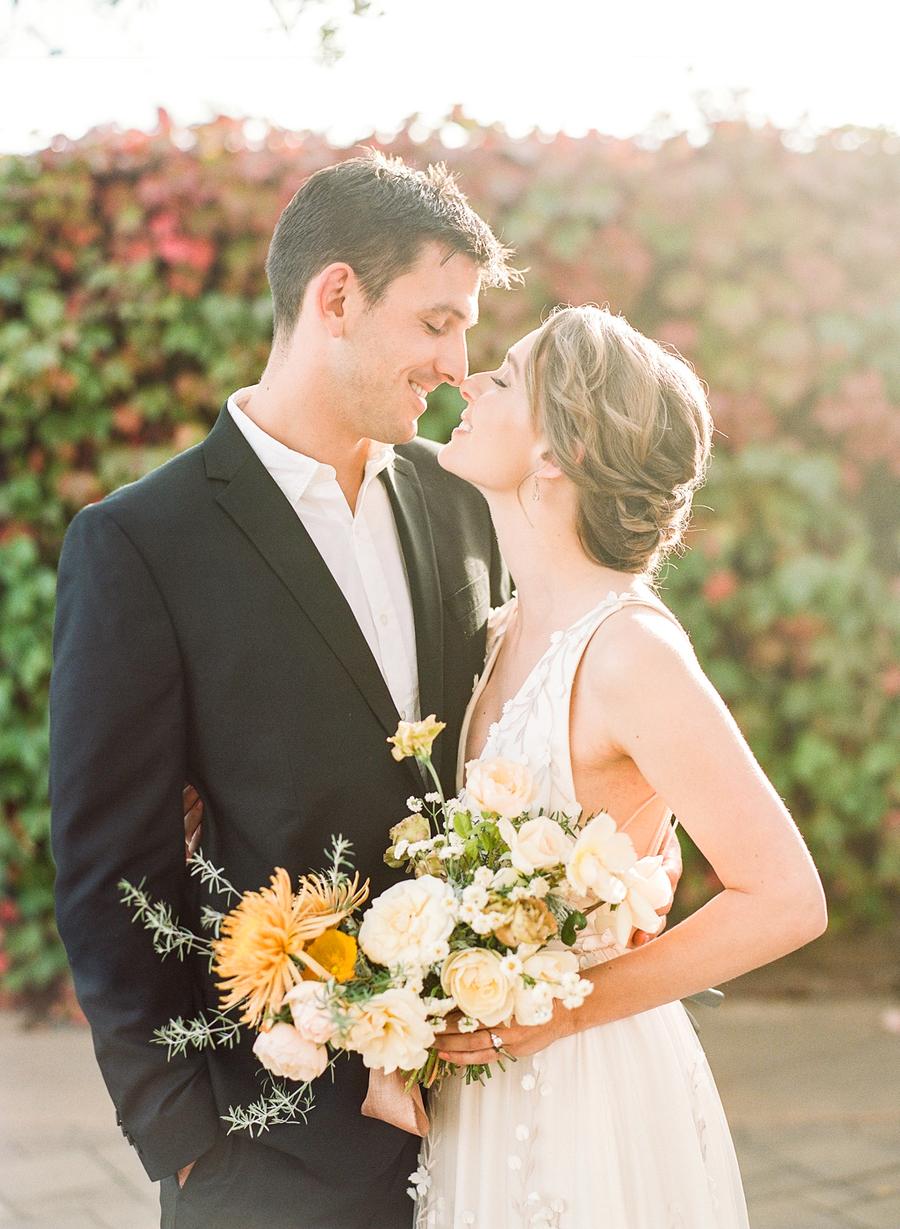 The wedding bouquet was done in neutrals and with sunny yellow blooms and lots of greenery