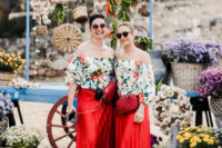 The bridesmaids were wearing bright off the shoulder tops and red pleated maxi skirts