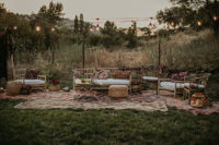 08 The wedding lounge was done with rattan furniture, boho rugs, candle lanterns