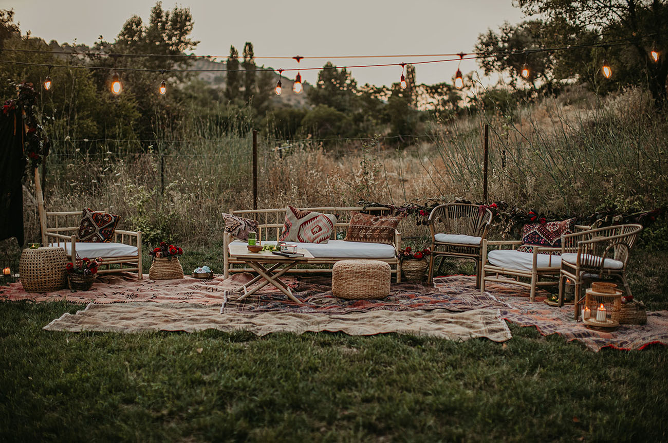 The wedding lounge was done with rattan furniture, boho rugs, candle lanterns