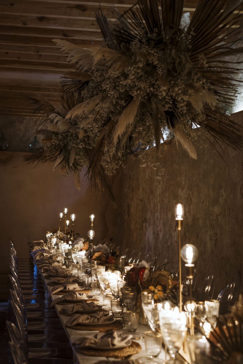 The wedding reception was done with an overhead pampas grass installation and dried touches