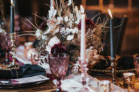 08 The wedding tablescape was done with black napkins, studded napkin rings, colored glasses, pink and black candles