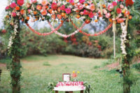a gorgeous wedding arch with bright touches