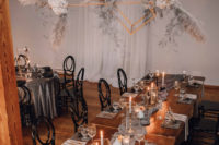 09 The wedding reception was done with an oversized installation with pampas grass, blush blooms, the wedding tables were styled with runners, candles