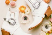 10 white Chelsea cowboy booties with large silver buckles for a boho touch or a Western wedding